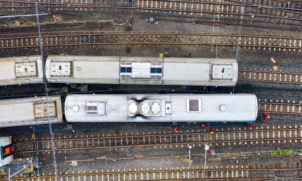 Top-down view of trains and multiple rail tracks used as an aerial survey image for transit corridor planning