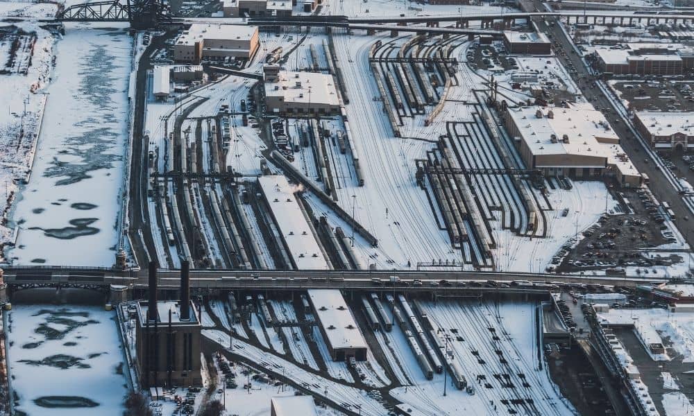 Aerial view of a Chicago freight rail yard with multiple tracks and industrial buildings, a setting where an ALTA survey can document property features