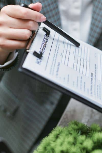 Chicago elevation certificate process - ALTA SURVEY Illinois Professional reviewing FEMA Elevation Certificate paperwork for a Chicago property