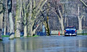 Flooded residential street in Chicago illustrating the need for a FEMA Elevation Certificate for flood insurance