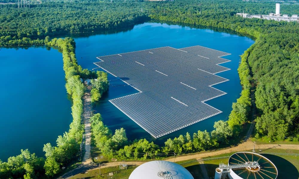 Aerial view of waterfront infrastructure and floating solar panels, showing why an ALTA Land Title Survey is important after storms.