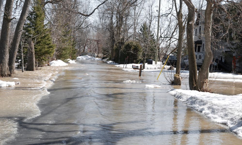 Winter street flooding showing hidden infrastructure problems and the need for a construction survey