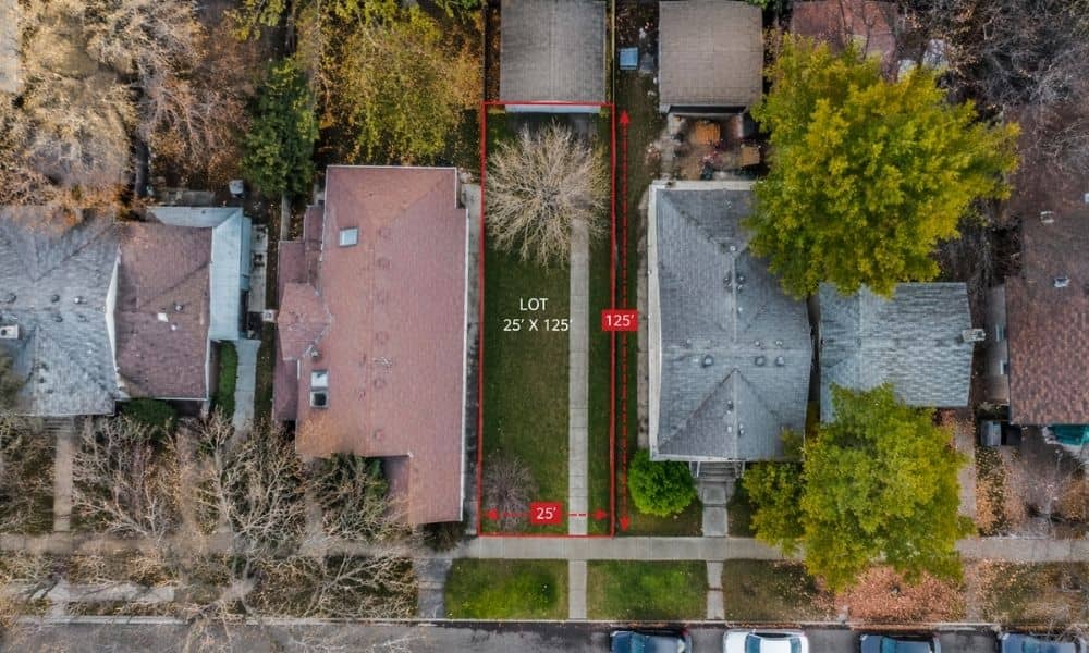 Aerial view of a narrow residential lot with boundary lines showing how surveying companies help define property limits in tight city spaces