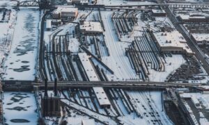 Aerial view of a Chicago freight rail yard with multiple tracks and industrial buildings, a setting where an ALTA survey can document property features